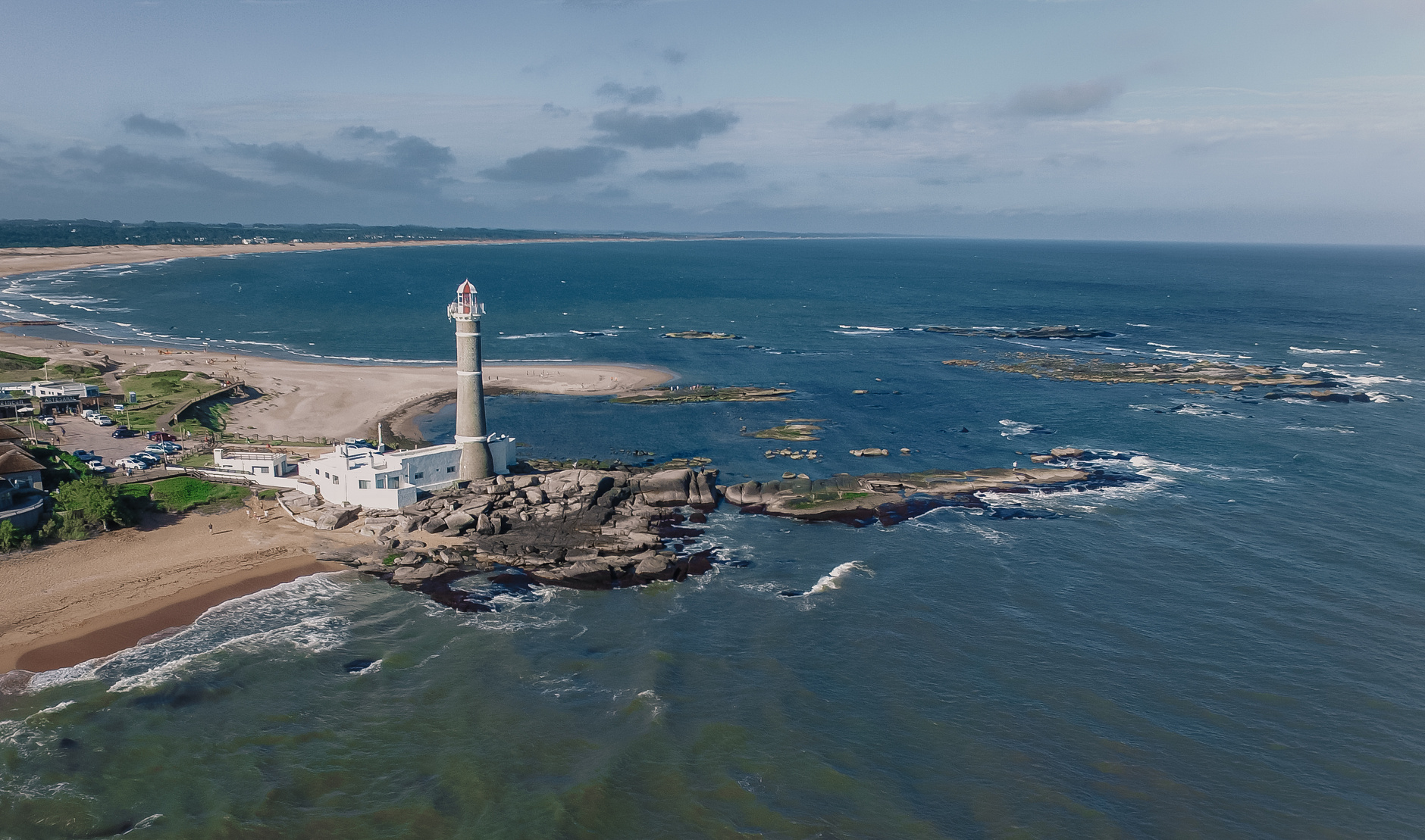 Aerial View of Lighthouse on the Shore